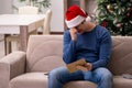 Young man celebrating Christmas alone at home Royalty Free Stock Photo