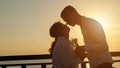 Young disabled man gives present for woman at back sunset Royalty Free Stock Photo