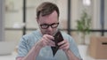 Young Man Checking Empty Wallet at Work Royalty Free Stock Photo