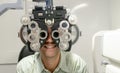 Young man checking his eyes to make glasses Royalty Free Stock Photo