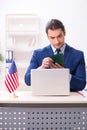 Young man checking passport at USA embassy Royalty Free Stock Photo