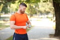 Young man checking pulse after workout Royalty Free Stock Photo