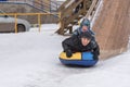 A young man with a cheerful boy with a roller coaster ride in th Royalty Free Stock Photo