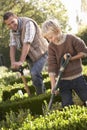 Young man with child working in garden