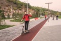 young man chooses not public transport, but a personal or rented electric scooter to get to work quickly and safely