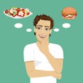 Young man choosing between hamburger and salad. Healthy and junk food concept