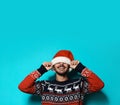 Young man in Christmas sweater and hat Royalty Free Stock Photo