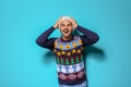 Young man in Christmas sweater and knitted hat Royalty Free Stock Photo