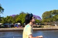 Young man on CityCat on Brisbane River returning from Colorfest where participants throw colourful powder in the air to express fr Royalty Free Stock Photo