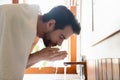 Young man clean face in home bathroom Royalty Free Stock Photo