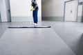 Young Man Cleaning The Floor With Mop Royalty Free Stock Photo