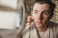 Young Man Cleaning his Face at Home Royalty Free Stock Photo