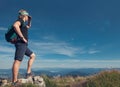 Young man climber on the top of mountain Royalty Free Stock Photo