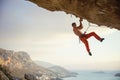 Young man climbing challenging route in cave Royalty Free Stock Photo