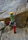 Young man is climbing crack in the rock in Squamish in sector Burgers and Fries. Royalty Free Stock Photo