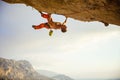 Young man climbing on ledge in cave before sunset Royalty Free Stock Photo