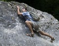 Young man climbing rock Royalty Free Stock Photo