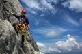 Young man climbing on a rock in Swiss Alps Royalty Free Stock Photo