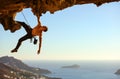 Young man climbing on roof of cave Royalty Free Stock Photo