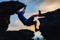 Young man climbing on top of rock mountain Royalty Free Stock Photo