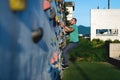 Young man climbing wall rock outdoors Royalty Free Stock Photo