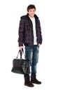 Young man in coat holding bag