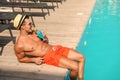 Young man with cocktail near pool Royalty Free Stock Photo