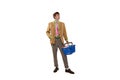 Young man in colorful official suit standing with shopping trolley isolated over white background Royalty Free Stock Photo