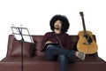 Young man composing song and listening music