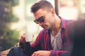 Young man connecting with a laptop at the bar Royalty Free Stock Photo