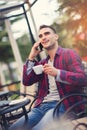 Young man connecting with a laptop at the bar Royalty Free Stock Photo