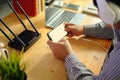 Young man Connecting router wifi On smartphone  for Internet and social media Royalty Free Stock Photo