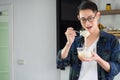 Young man cook wearing casual cloth in the kitchen. Young man worker uses whisk and bowl for making mixing ingredients in a bowl Royalty Free Stock Photo