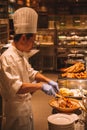 Young man cooking amazing Asian kitchen dinner