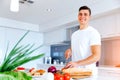 Young man cooking Royalty Free Stock Photo