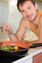 Young man cooking sea food. Royalty Free Stock Photo