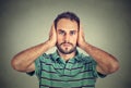 Young man covering his ears with hands Royalty Free Stock Photo