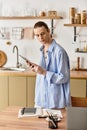 Young man in a cozy kitchen Royalty Free Stock Photo