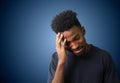 Young man crying hand in face studio portrait Royalty Free Stock Photo