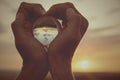 Young man with a crystal ball in his hands Royalty Free Stock Photo