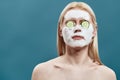 Young man with cucumber slices and foam mask Royalty Free Stock Photo