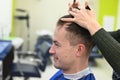 The young man cut his hair at the hairdresser. haircut at the hairdresser. Barbershop