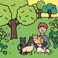 Young man with cute cats mascots on the park Royalty Free Stock Photo