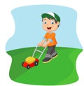 Young man cutting grass with a push lawn mower Royalty Free Stock Photo