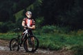 The young man cycling on mountain bike ride Cross-country