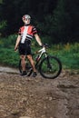 The young man cycling on mountain bike ride Cross-country