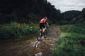 The young man cycling on mountain bike ride Cross-country