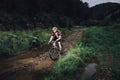 The young man cycling on mountain bike ride Cross-country