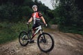 The young man cycling on mountain bike ride Cross-country