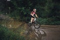 The young man cycling on mountain bike ride Cross-country